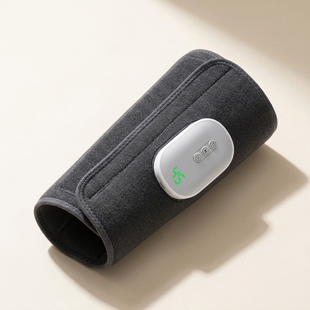 Cordless calf massager sleeve, rolled, showing the control pod and green display